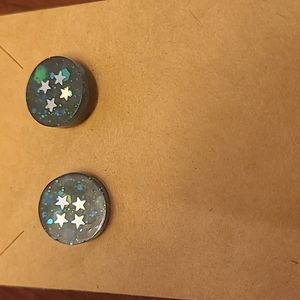 Glittery stars in space stud earrings